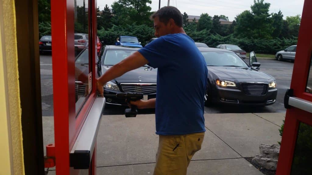 image of owner Will Lanier installing a new crash bar for a commercial client