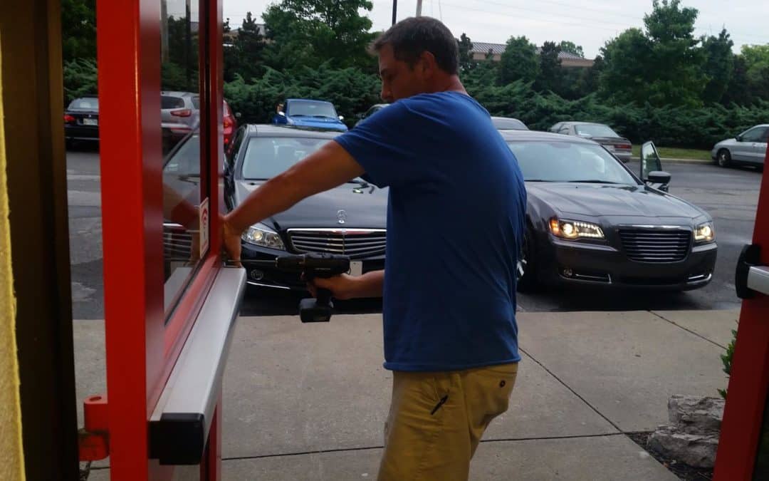 image of owner Will Lanier installing a new crash bar for a commercial client